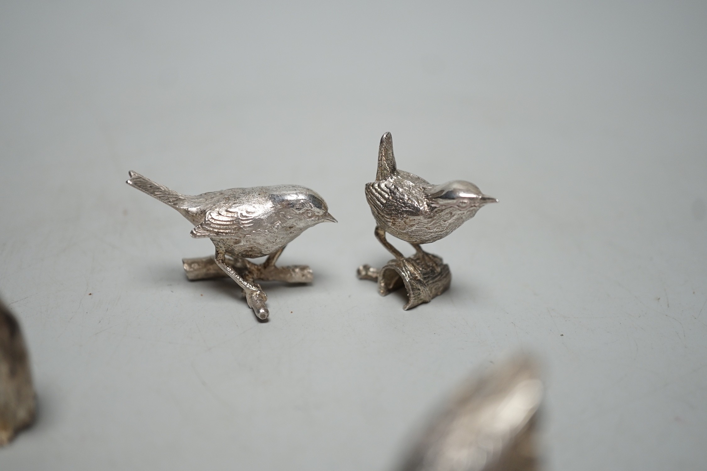A small collection of seven 1980's/1990's miniature silver models, by Paul Eaton, comprising five birds, a rabbit and a penguin, tallest 43mm.